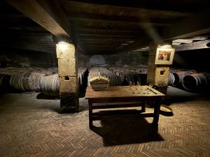 Traditional Cognac aging cellar with oak barrels in France